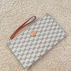 Michael Kors Leather Wristlet in MK Signature Logo